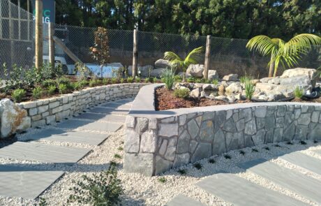 Robust retaining garden wall, path and plants